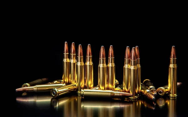 depositphotos_329427164-stock-photo-bullet-isolated-on-black-background
